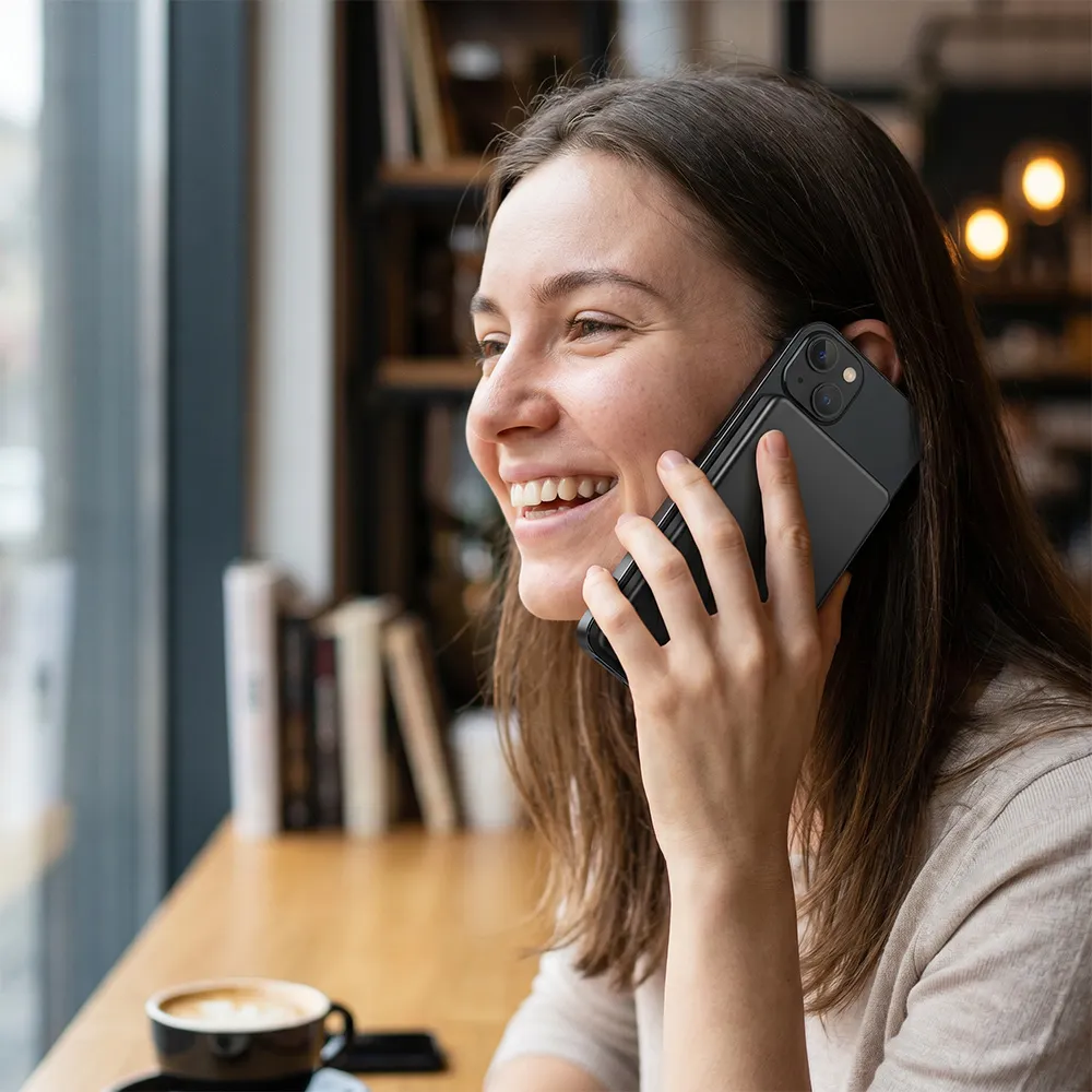 Lifestyle image of magnetic power bank attached to phone
