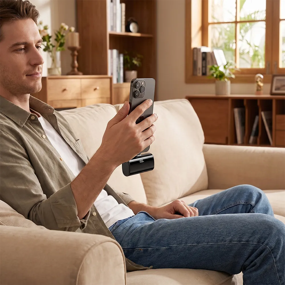 Customer using the compact power bank while relaxing at home